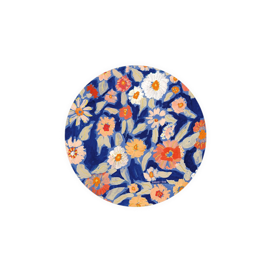Floral coasters by Margaret Jeane, with a botanical design featuring multicolored blossoms and leaves.