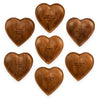 Wood carved trinket trays with laser-etched text, arranged in a circle on a white background.