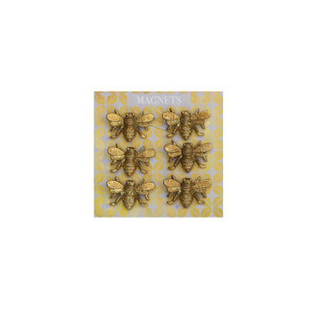 Set of six gold-colored bee magnets with a textured finish on a patterned backing.