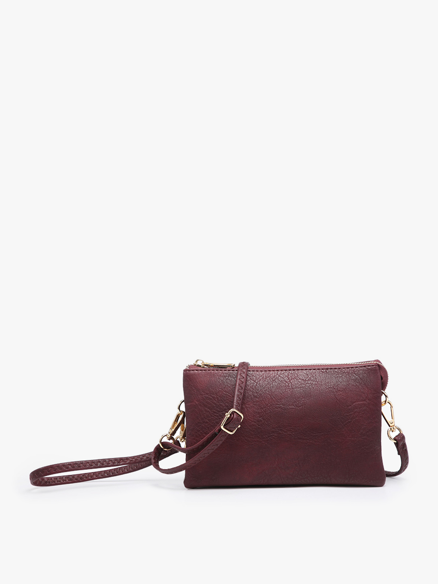Plum crossbody wristlet by an unseen vendor, with gold-toned hardware and textured finish.